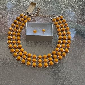 Yellow three row necklace with matching post earrings. Costume jewelry.